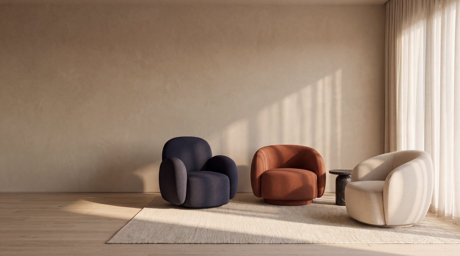 Talia, Cleo and Romy swivel chairs in Midnight, Tobago rust and Dune in an afternoon-lit room