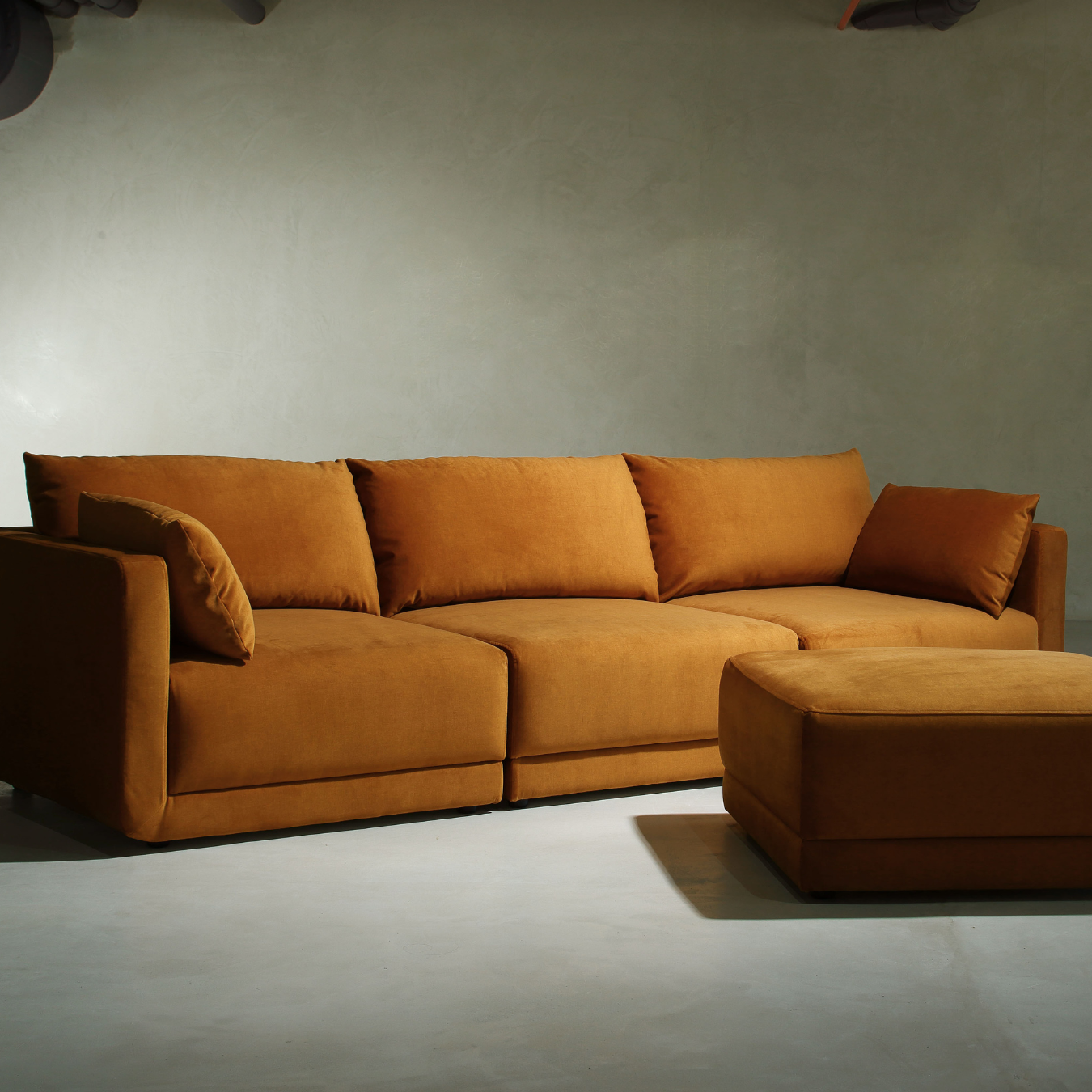 Muze olive green velvet modular sofa with natural light